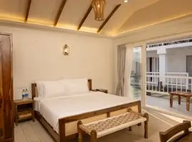 A cozy bedroom with a comfortable bed and a lovely balcony overlooking a scenic view. Rest and relax in style!
